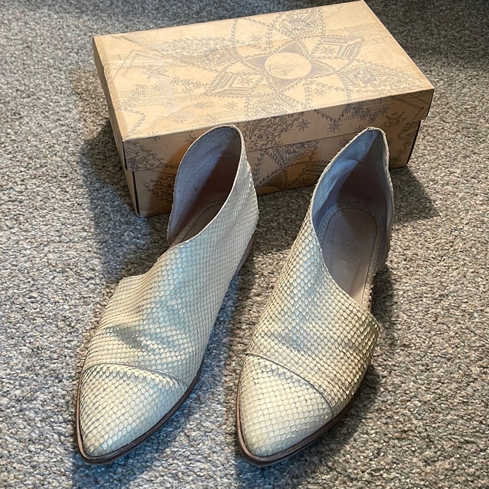 A Pair of Free People Flat Royale White Leather Shoes